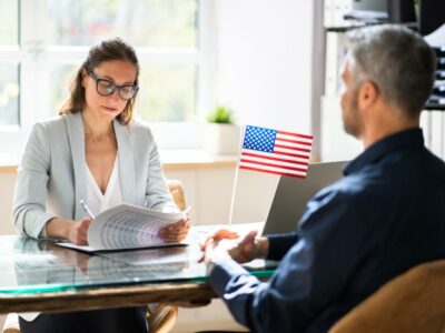 services-04 An O1 Visa Holder Sits In An Immigration Office 400x300 1